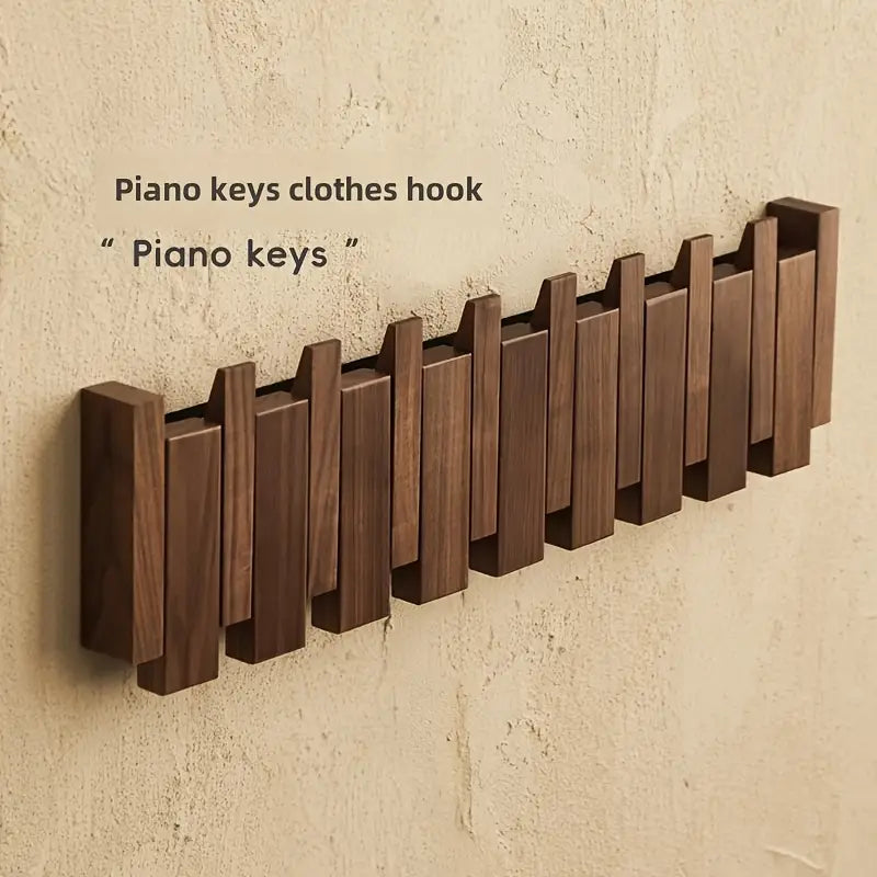 Piano key-inspired walnut coat rack for entryway decor